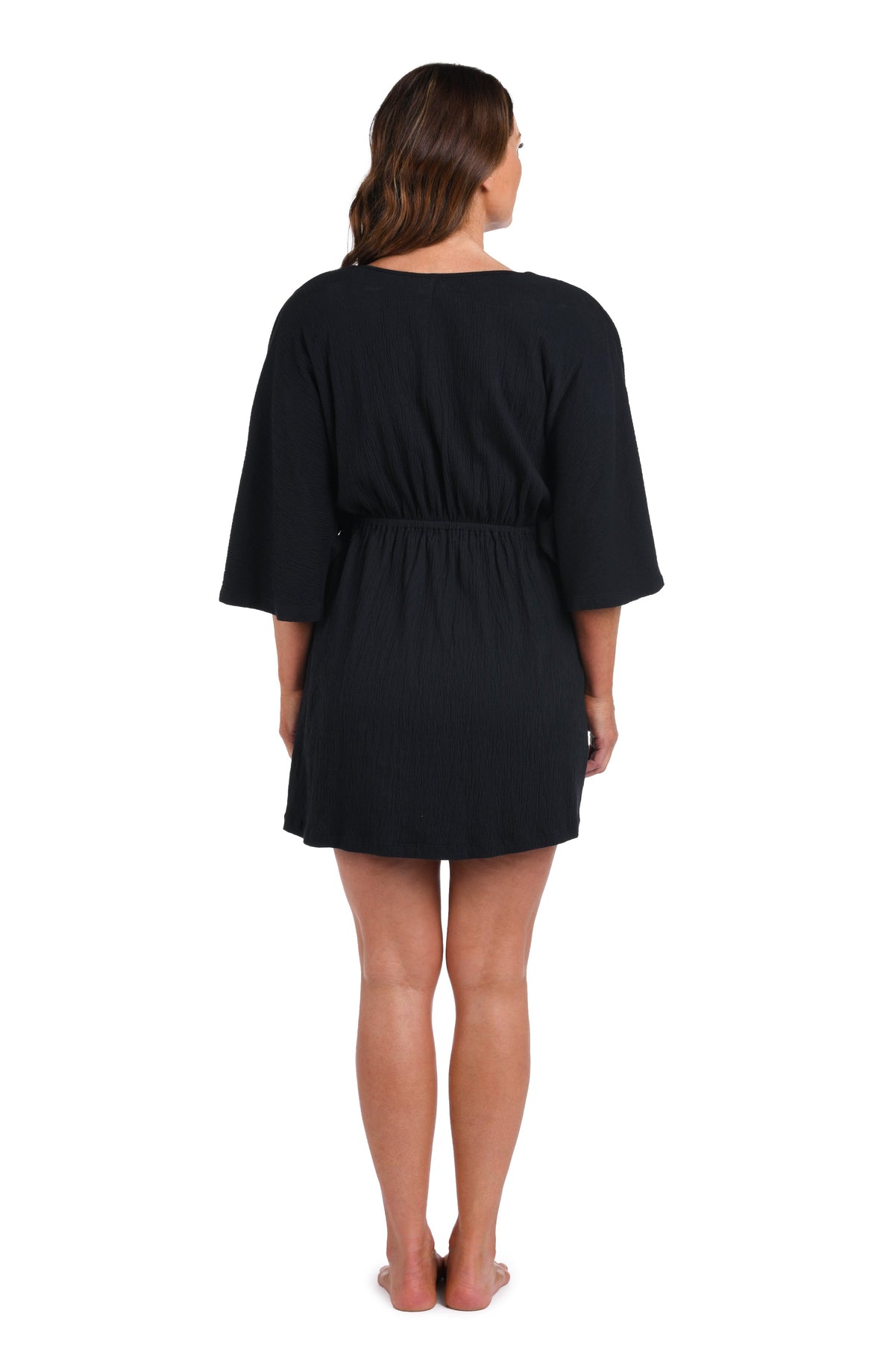 Model is wearing a black Solid Kimono Tunic Cover Up.