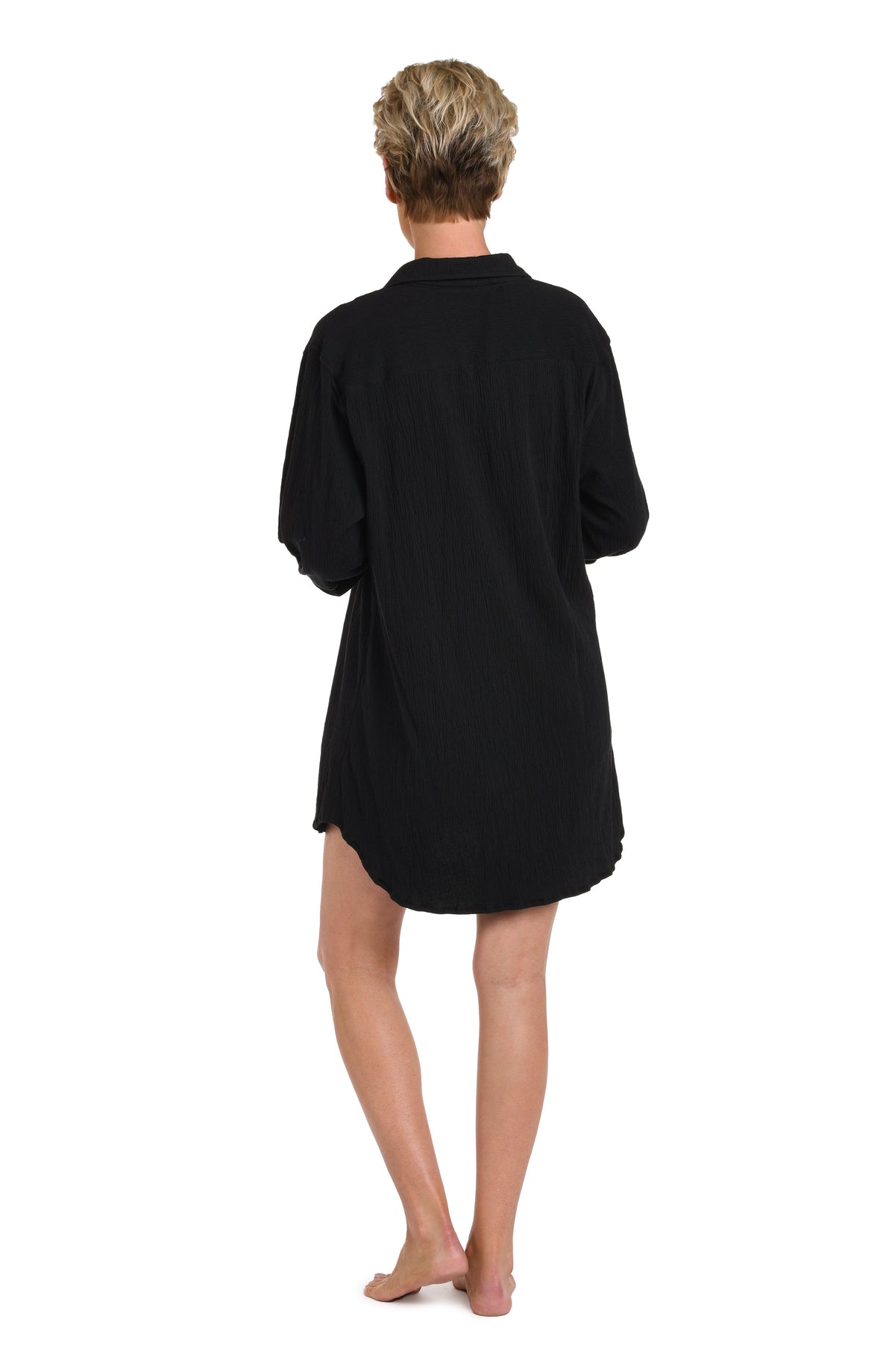 Model is wearing a solid black Button Down Resort Shirt Cover Up.