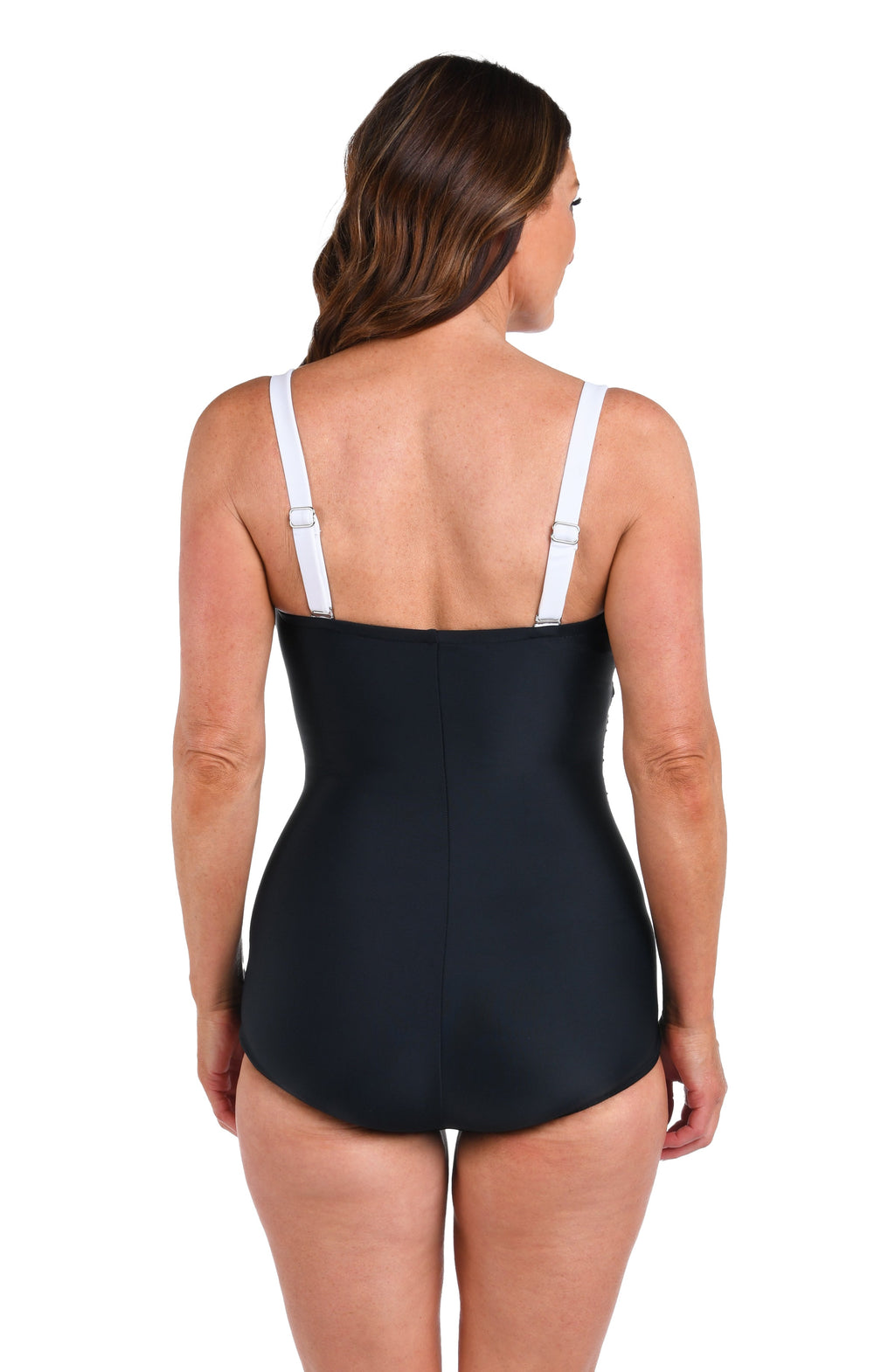 Model is wearing a solid black Bandeau Girl Leg One Piece.