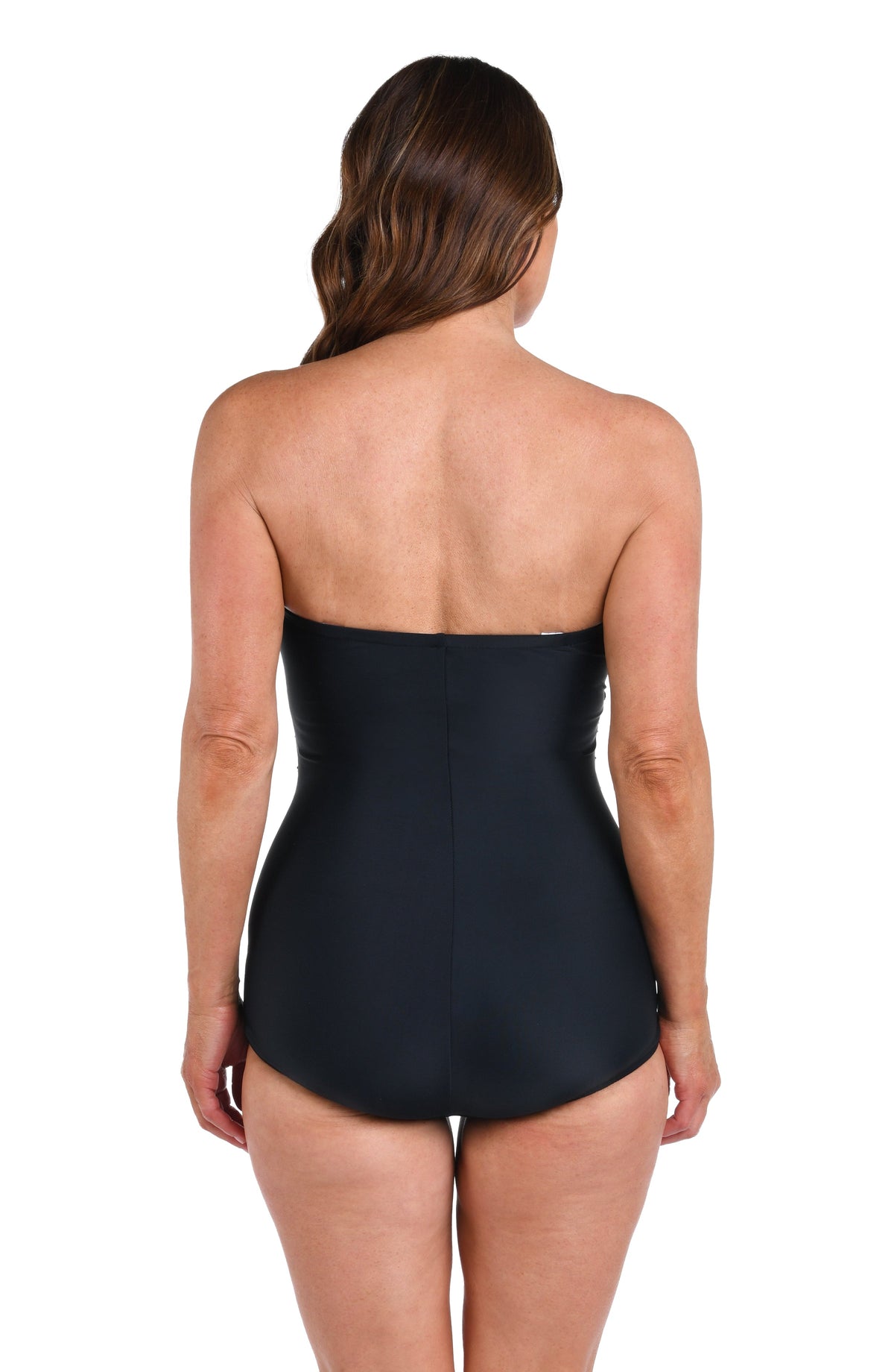Model is wearing a solid black Bandeau Girl Leg One Piece.