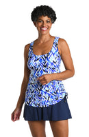 Model is wearing a multicolored Shirred Skirted Swim Dress One Piece Swimsuit