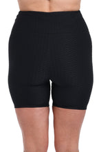 Model is wearing a Textured Spa Bike Short Swimsuit Bottom.