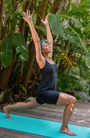 Lifestyle image of model wearing a Textured Spa Scoop Neck Tankini Top.