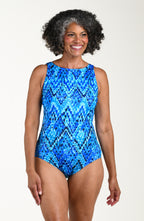 Woman wearing a blue patterned swimsuit on a white background
