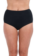 A close-up of a model wearing solid black high-waisted bikini bottoms against a plain white background.