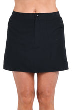 Model is wearing a solid black woven boardskirt bottom.