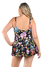 Woman wearing a floral swim dress on a white background