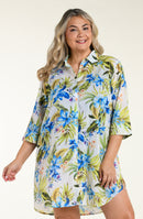 Front image of model wearing a white resort shirt with a floral print.