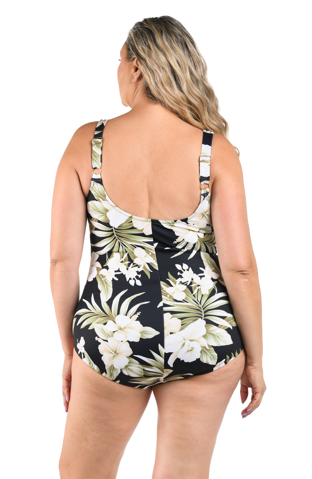 Woman wearing a floral swimsuit with a white background