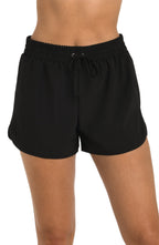 Front image of model wearing the 24th & Ocean Solid Woven Board Short.