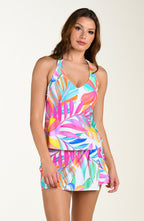 Front image of model wearing a multicolored tropical printed swim skort featuring twist front detail and full coverage. This is paired with a matching tankini top.