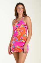 Front image of model wearing a multicolored floral printed swim skort featuring a high waist, built in short, and pocket. This is paired with a matching tankini top. 