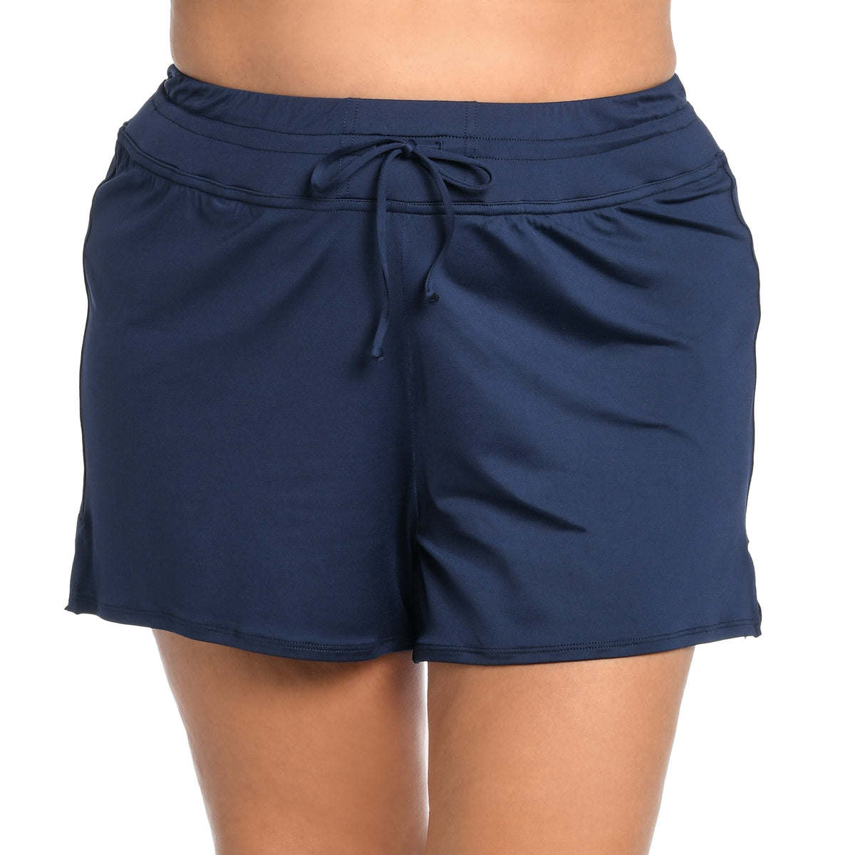 Front image of model wearing a solid midnight colored swim short featuring a mid rise fit and front tie. 