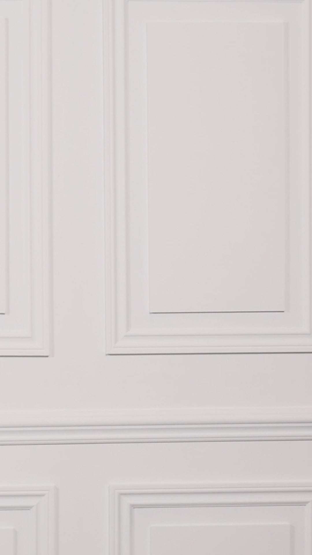 Video of a woman wearing a floral one-piece swimsuit on a plain background