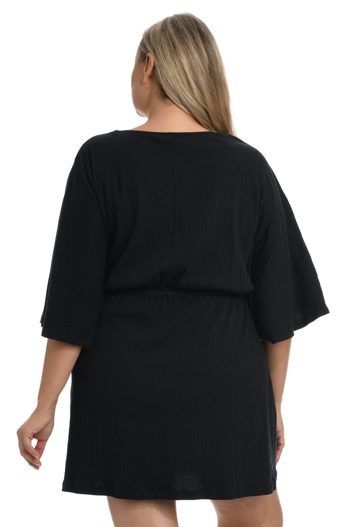 Model is wearing a solid white colored front tie tunic cover up. 