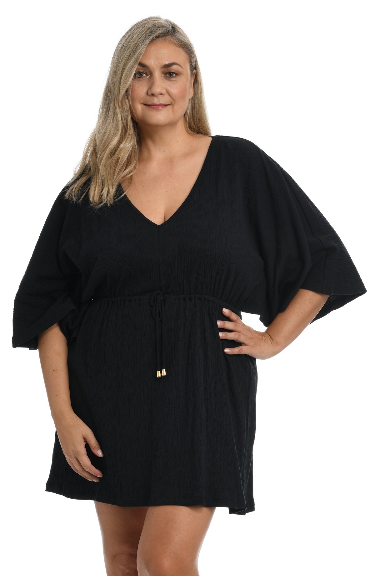 Model is wearing a solid white colored front tie tunic cover up. 