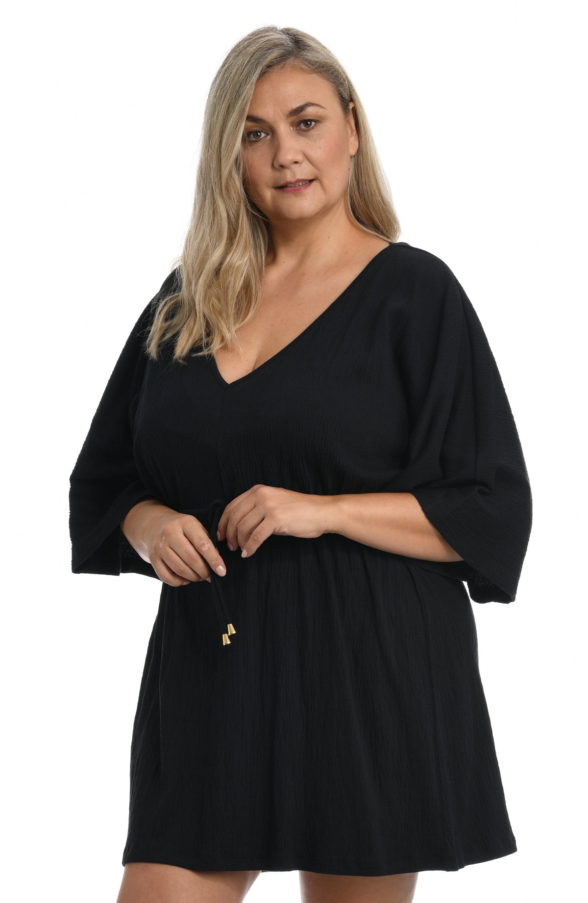 Model is wearing a solid white colored front tie tunic cover up. 