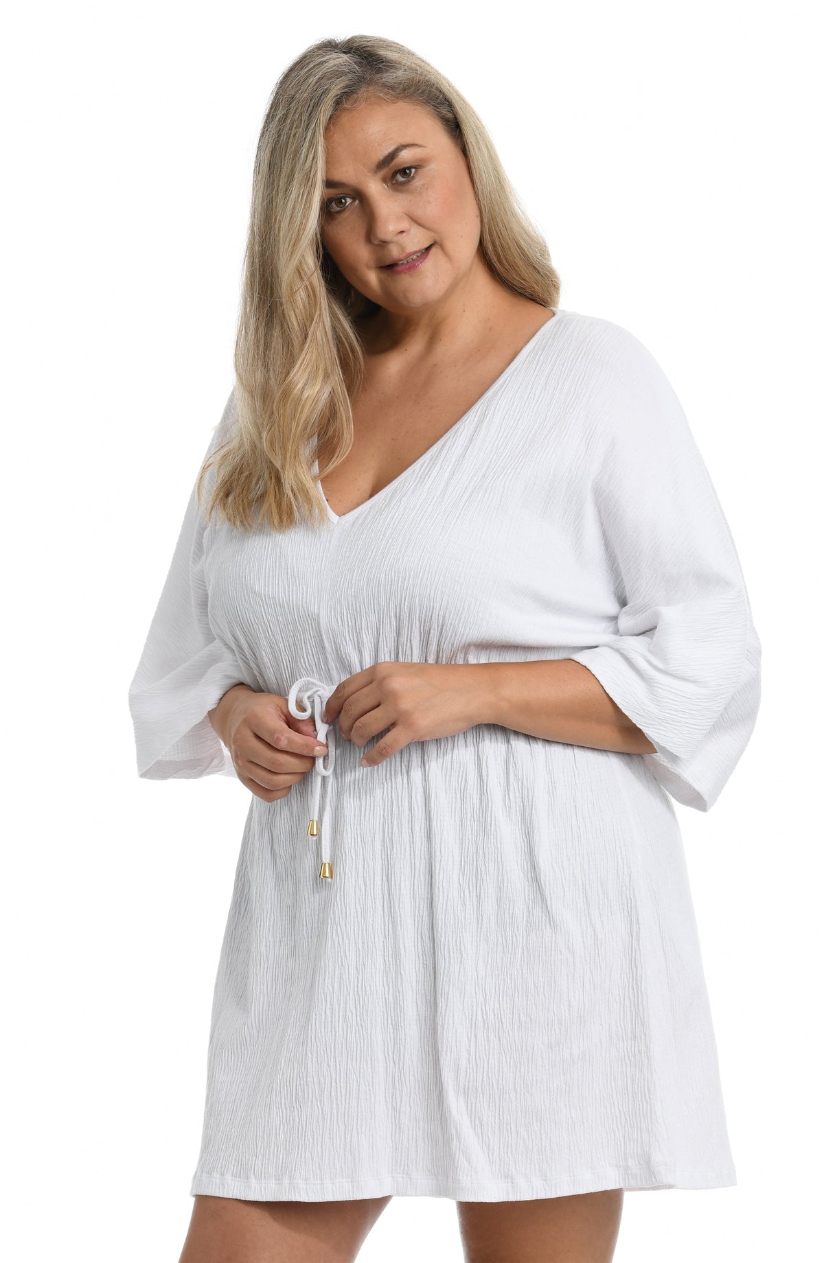 Model is wearing a solid black colored front tie tunic cover up. 