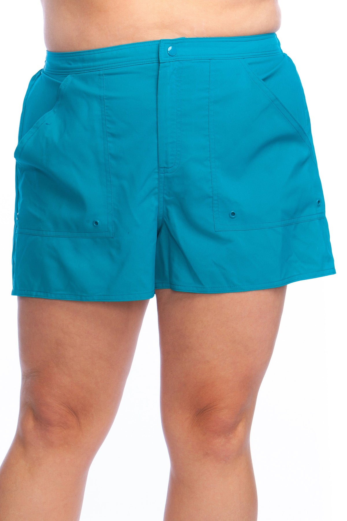 Model is wearing a solid cobalt blue colored woven board short bottom.