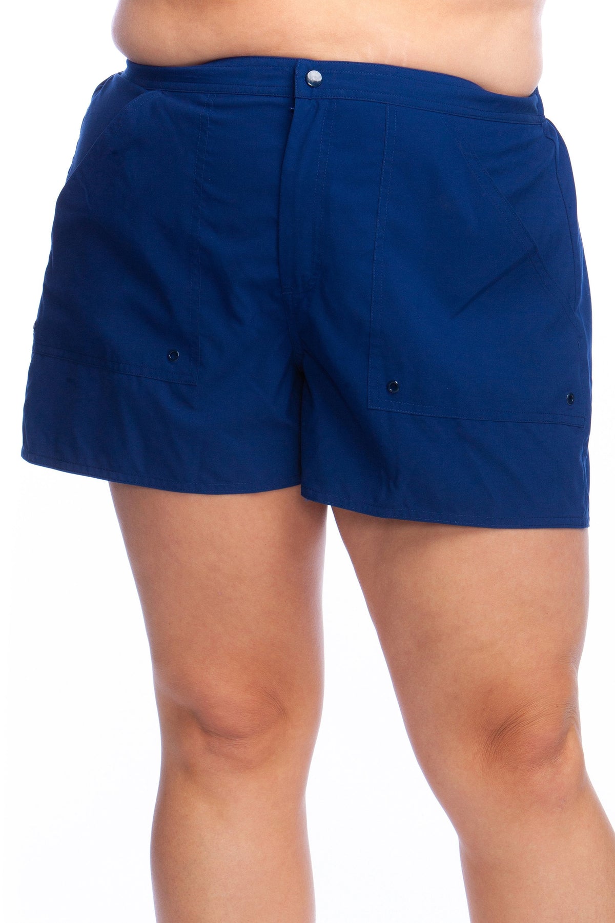 Model is wearing a solid black colored woven board short bottom.