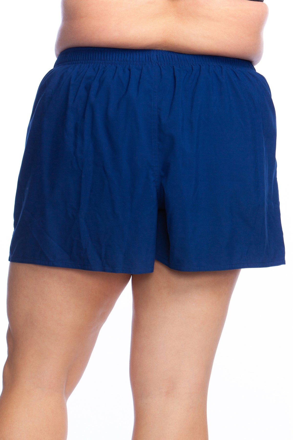 Model is wearing a solid black colored woven board short bottom.