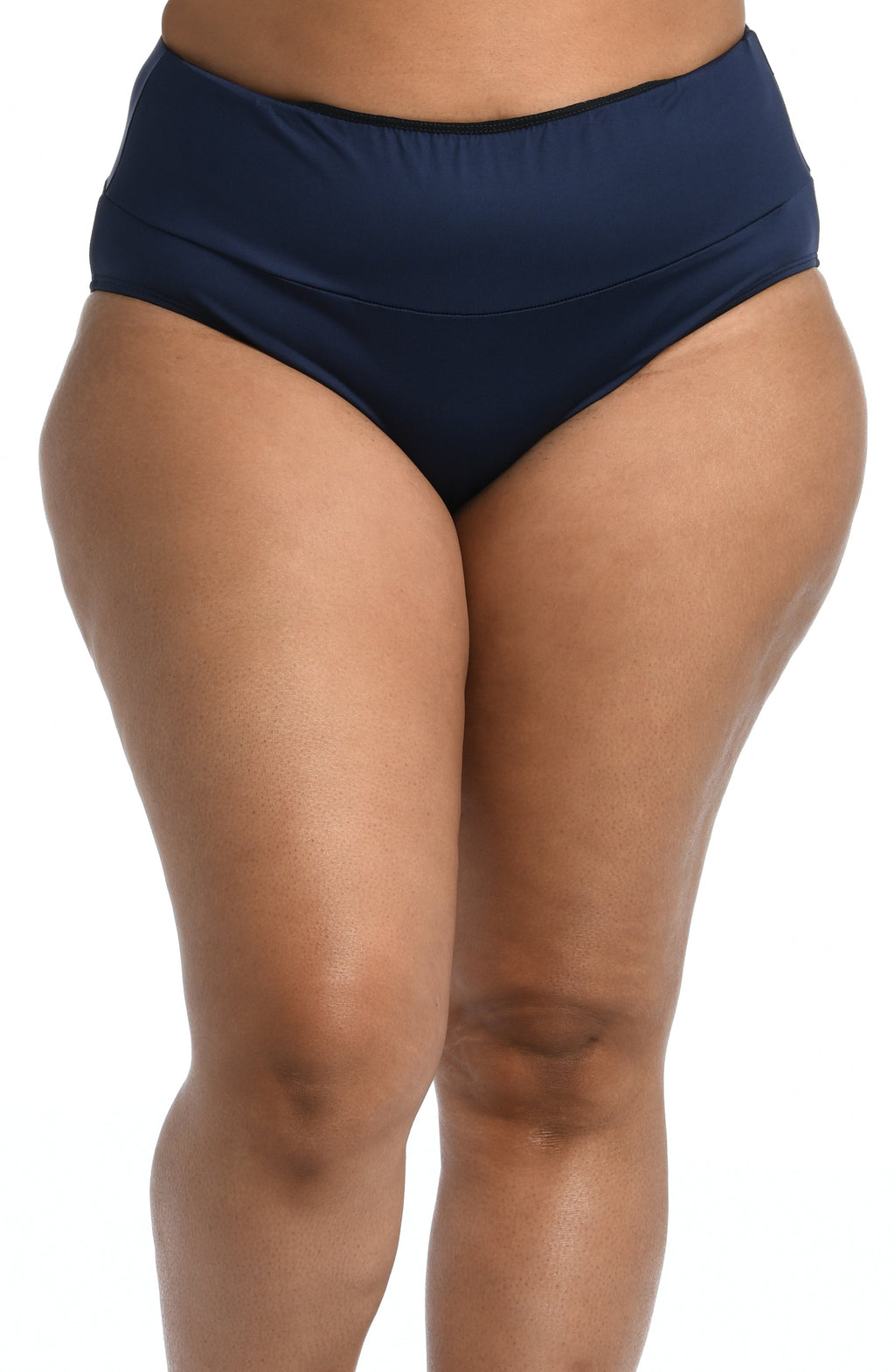 Model is wearing a solid midnight blue mid waist spliced hipster bikini bottom from our 24th & Ocean brand.